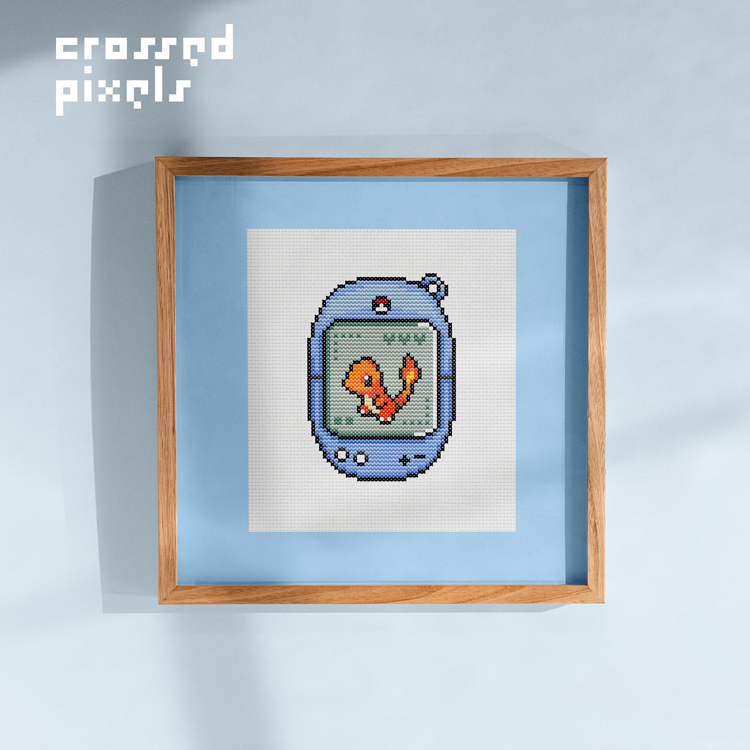 pixel art style cross stitch pattern of pokemon Charmander in Tamagotchi