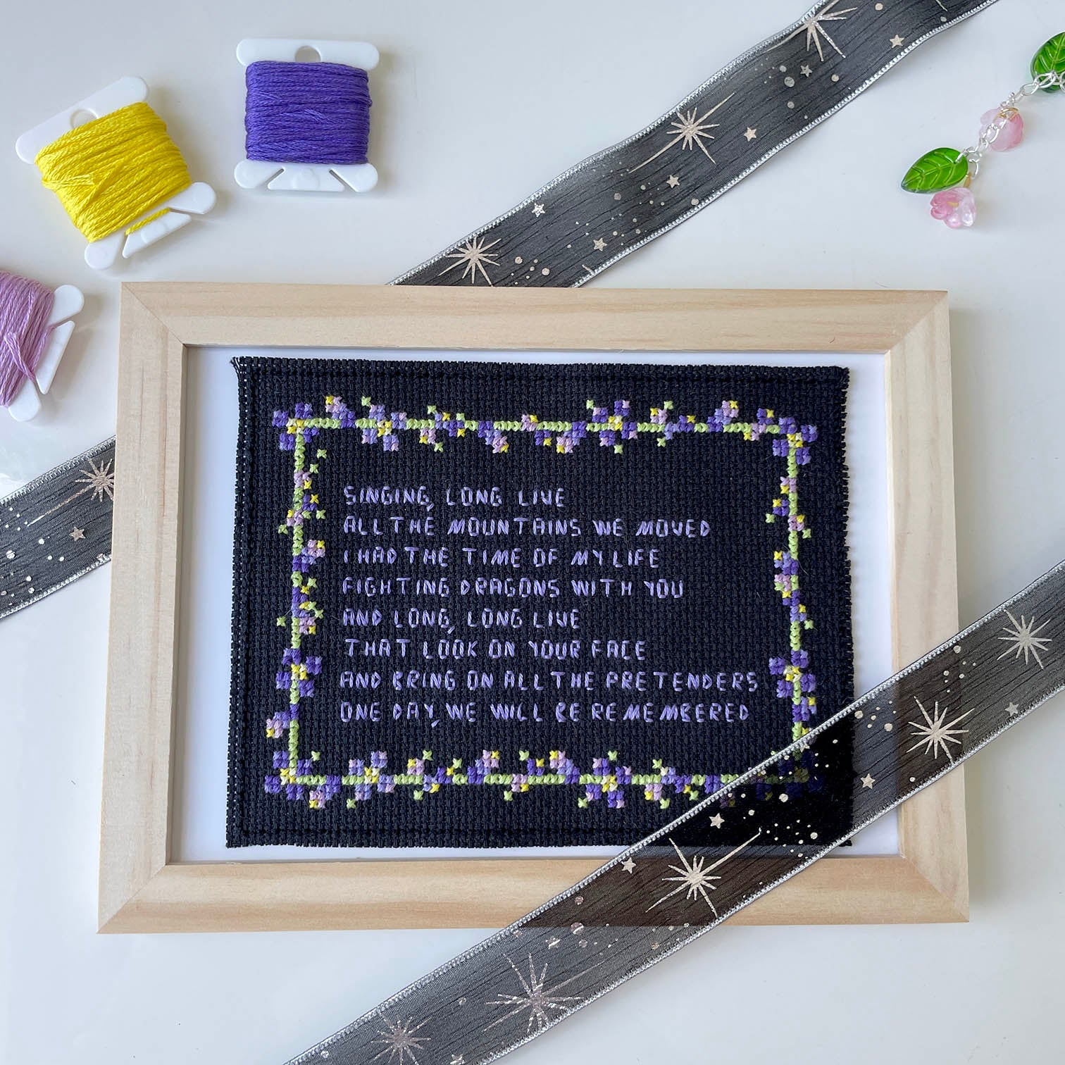 pixel art style cross stitch pattern of Taylor Swift lyrics